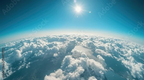 Stunning aerial view of clouds and earth with bright sun