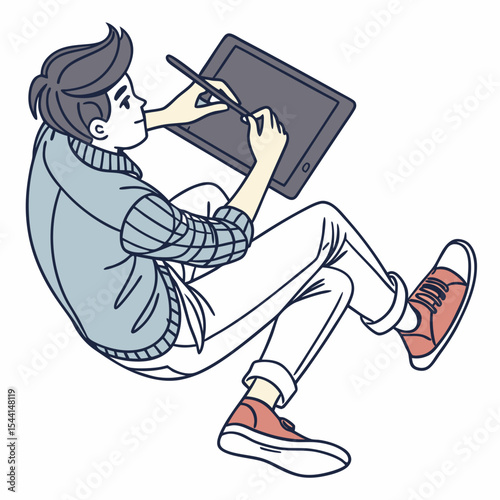 Young man using graphics tablet digital art design