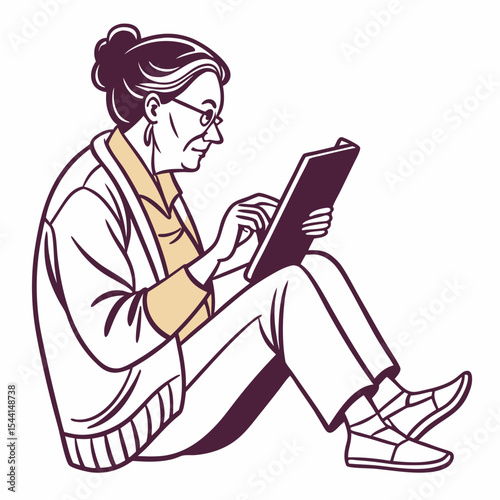 Elderly woman sitting using tablet device