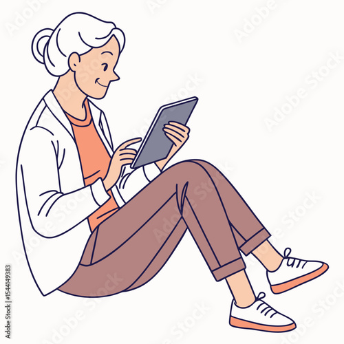 Senior woman sitting floor using tablet device
