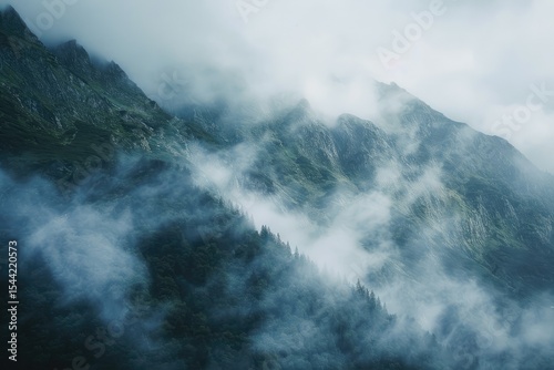 Beautiful Shot of a Mountain with the Clouds Creating a Foggy Atmosphere