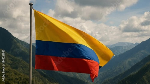 Colombian flag waving at sunrise over the Andes mountains