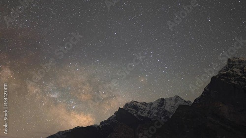 4K Zoom in timelapse of milkyway rising over Himalaya mountains as seen from Lahaul, Himachal Pradesh, India. Time lapse of starry night sky. Travel, hiking and exploring nature. Milky way galaxy. 
