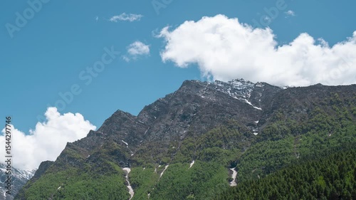 Beautiful Mountain with Moving Clouds in Shipting village in Lahaul, India. Summer timelapse of Himalayas. Nature landscape. Travel and holidays concept. 4K time lapse of summer mountains.