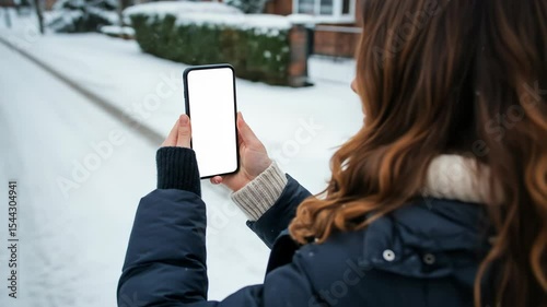 Woman Holds Phone with White Screen in Snowy Landscape