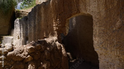 Ancient rupestrian settlement carved into sandstone rock in Zungri, Calabria, Italy, showing intricate details and historical significance