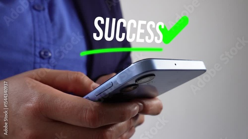 Person's hands and cell phone with the word 