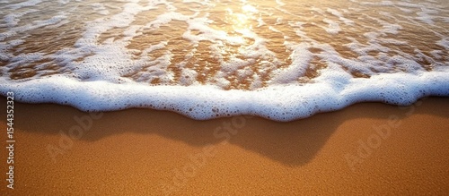 Sea Wave on Beach at Sunset