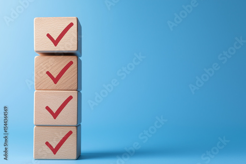 Checklist concept. Correct sign tick check mark on wooden block with copy space for the checklist on blue background. Business survey questionnaire, Exam test process photo