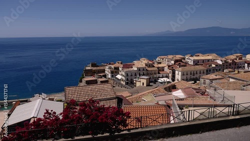 Red blooming bougainvillea and terracotta roofs characterize Pizzo Calabro, a picturesque village facing the Tyrrhenian Sea