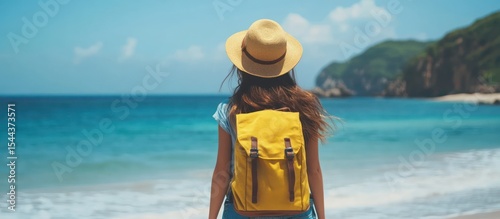 Woman with Backpack on Beach