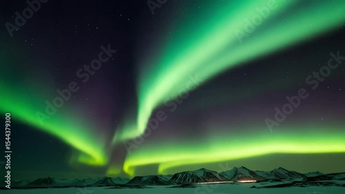 Spectacular Northern Lights Display Over Snowy Mountain Landscape with Dancing Green Aurora Borealis