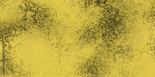 Abstract background with speckled elements and subtle texture in shades of yellow and black ideal for artistic designs.