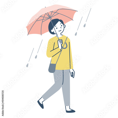雨の日に傘をさして歩く女性