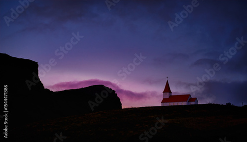 Purple and blue sunrise over Vik church in Iceland on top of a hillside , Travel in Iceland destination concept.