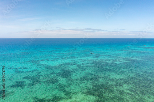 Fototapeta Naklejka Na Ścianę i Meble -  Tropical seascape with blue sea surface with coral reefs in Bantayan, Cebu. Philippines.