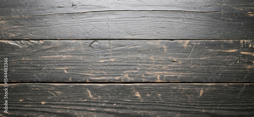 Distinct grain waves, layered paint loss, and surface distressing bring visual depth and authenticity to this vintage black wood backdrop.