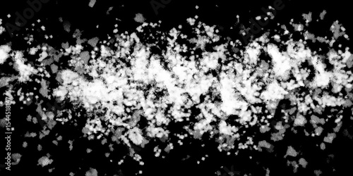 Snowflakes on dark background. white icy snowflakes isolated on black background, natural background. white crystalline powder on a black background. sugar dust. texture, pattern and clipping.