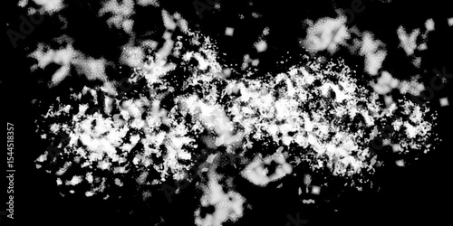 Snowflakes on dark background. white icy snowflakes isolated on black background, natural background. white crystalline powder on a black background. sugar dust. texture, pattern and clipping.