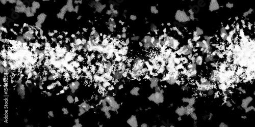 Snowflakes on dark background. white icy snowflakes isolated on black background, natural background. white crystalline powder on a black background. sugar dust. texture, pattern and clipping.