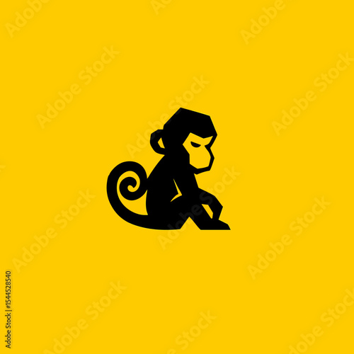 Black monkey silhouette on a bright yellow background