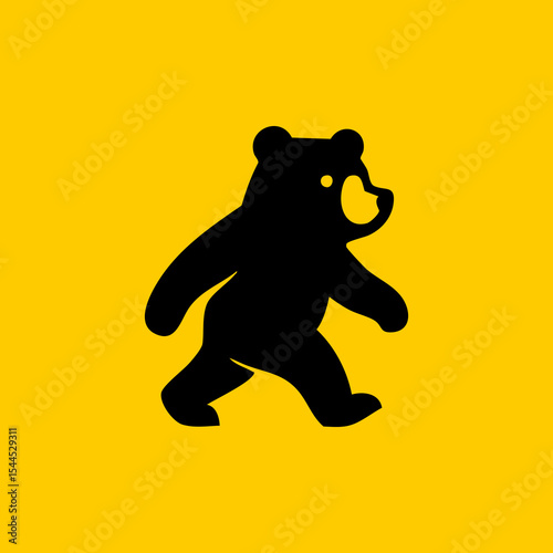 Simple black silhouette of a walking bear on a yellow background