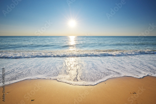 Beautiful coast of beach at the sunset. Sandy sea shore nature composition.