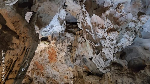 Stunning stalagmites and mineral-rich formations inside Thien Cung cave in Ha Long Bay, Vietnam.