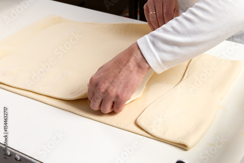 Pastry chef makes puff pastry.