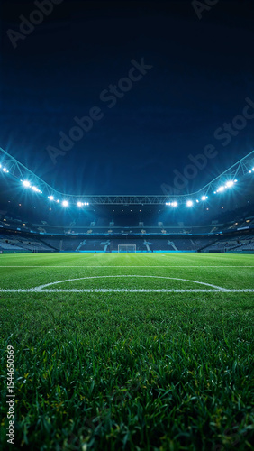 Illuminated soccer stadium field at night