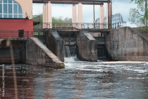 Dam of small hydroelectric power station, water discharge through locks