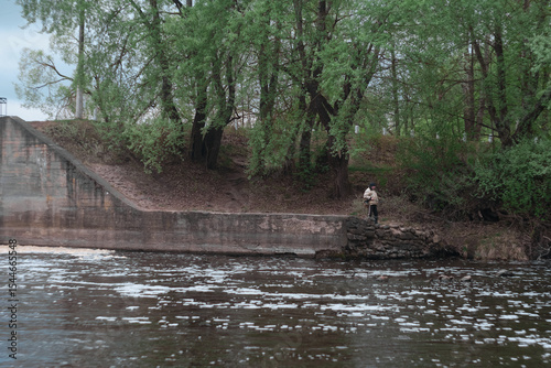 Dam of small hydroelectric power station, water discharge through locks