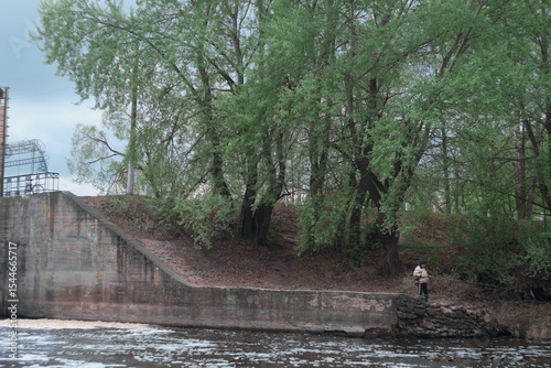 Dam of small hydroelectric power station, water discharge through locks