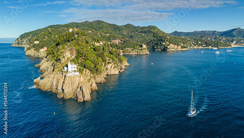 Photography Aerial view of the historic Faro di Portofino lighthouse in Portofino, Italy