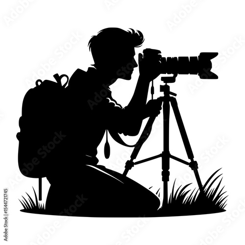 Silhouette of photographer with backpack and tripod