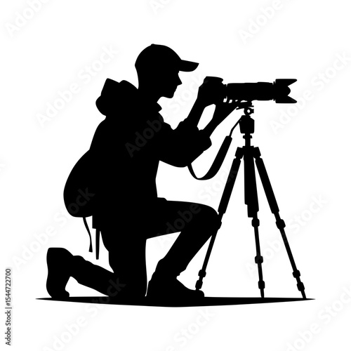 Photographer silhouette with camera on tripod