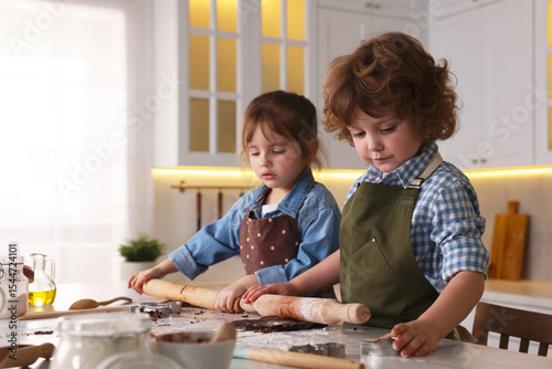 Cooking recipe. Little children making cookies at table in kitchen