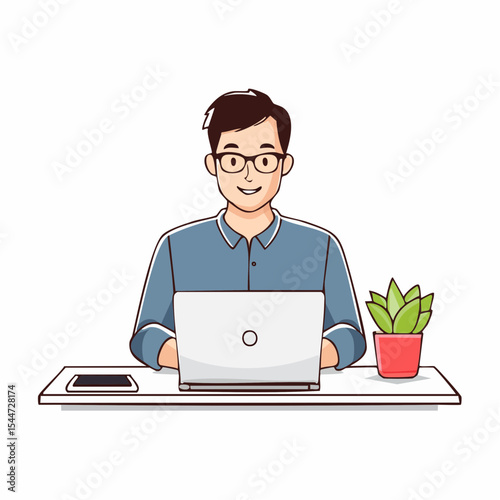 Smiling man works on laptop at a minimalist desk.