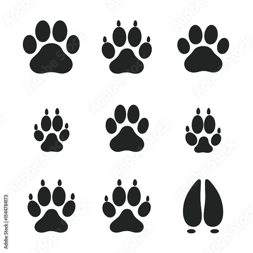 Wild Animal Tracks. Solid, filled icons set of wild animal tracks: lion paw, tiger footprint, leopard pad, fox