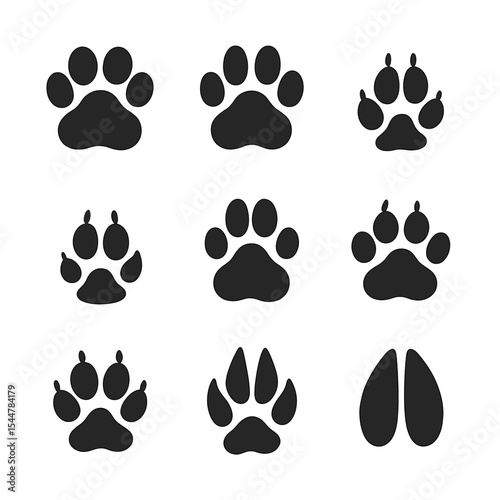 Wild Animal Tracks. Solid, filled icons set of wild animal tracks: lion paw, tiger footprint, leopard pad, fox