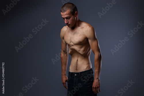 Photos Man suffering from anorexia on grey background
