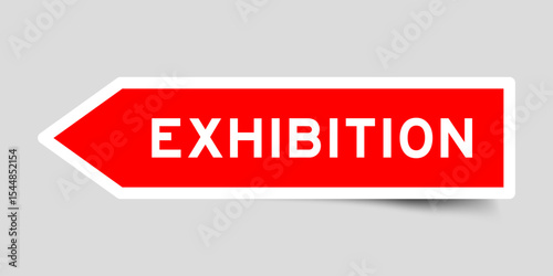 Red color arrow shape sticker label with word exhibition on gray background