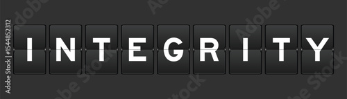 Black color analog flip board with word integrity on gray background
