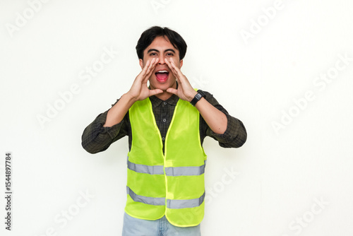 Portrait of an enthusiastic Asian construction worker making an announcement gesture, isolated on white background