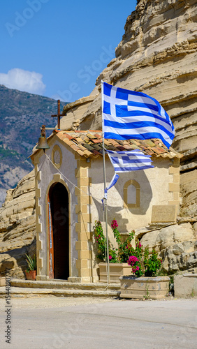 Small shrine and greek flag