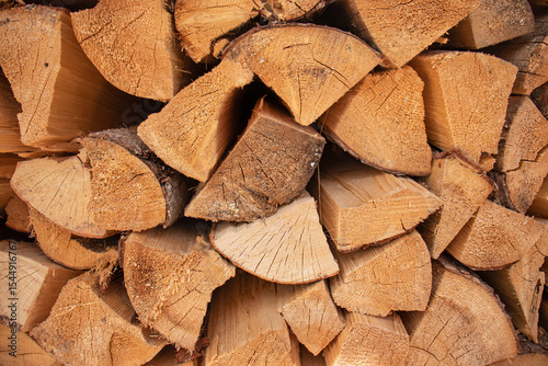 firewood background, Stack of freshly cut firewood logs arranged in a neat pile