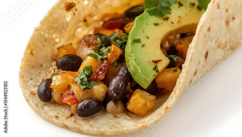 Close-up image showcasing two delicious black bean tacos with tomatoes, avocado, and cilantro toppings. Perfect for food blogs, menus, and social media posts.