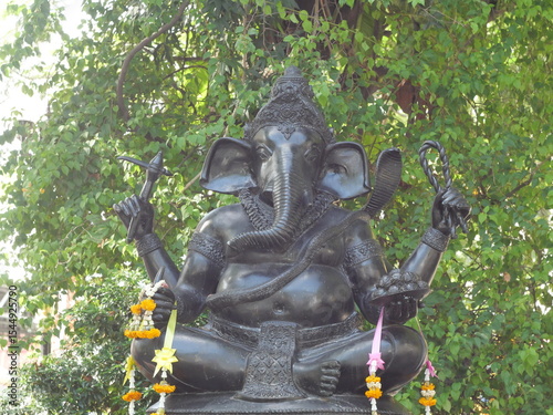 Invoke blessings with this striking Ganesha statue in Ayutthaya. Ideal for themes of success, prosperity, and overcoming obstacles, reflecting diverse beliefs in Thailand.