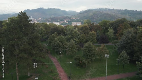 Ascending aerial footage of a large park located inside a medieval fort in town center of Novi Pazar, Serbia
