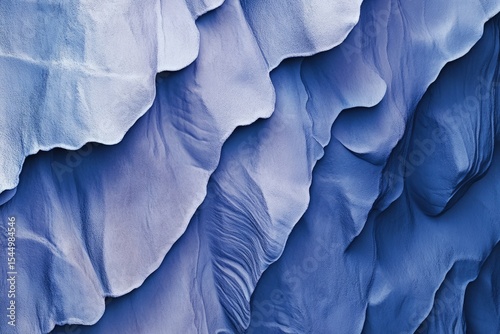 Wallpaper Mural Abstract aerial view of layered, blue sand dunes, creating a textured, flowing pattern. Torontodigital.ca